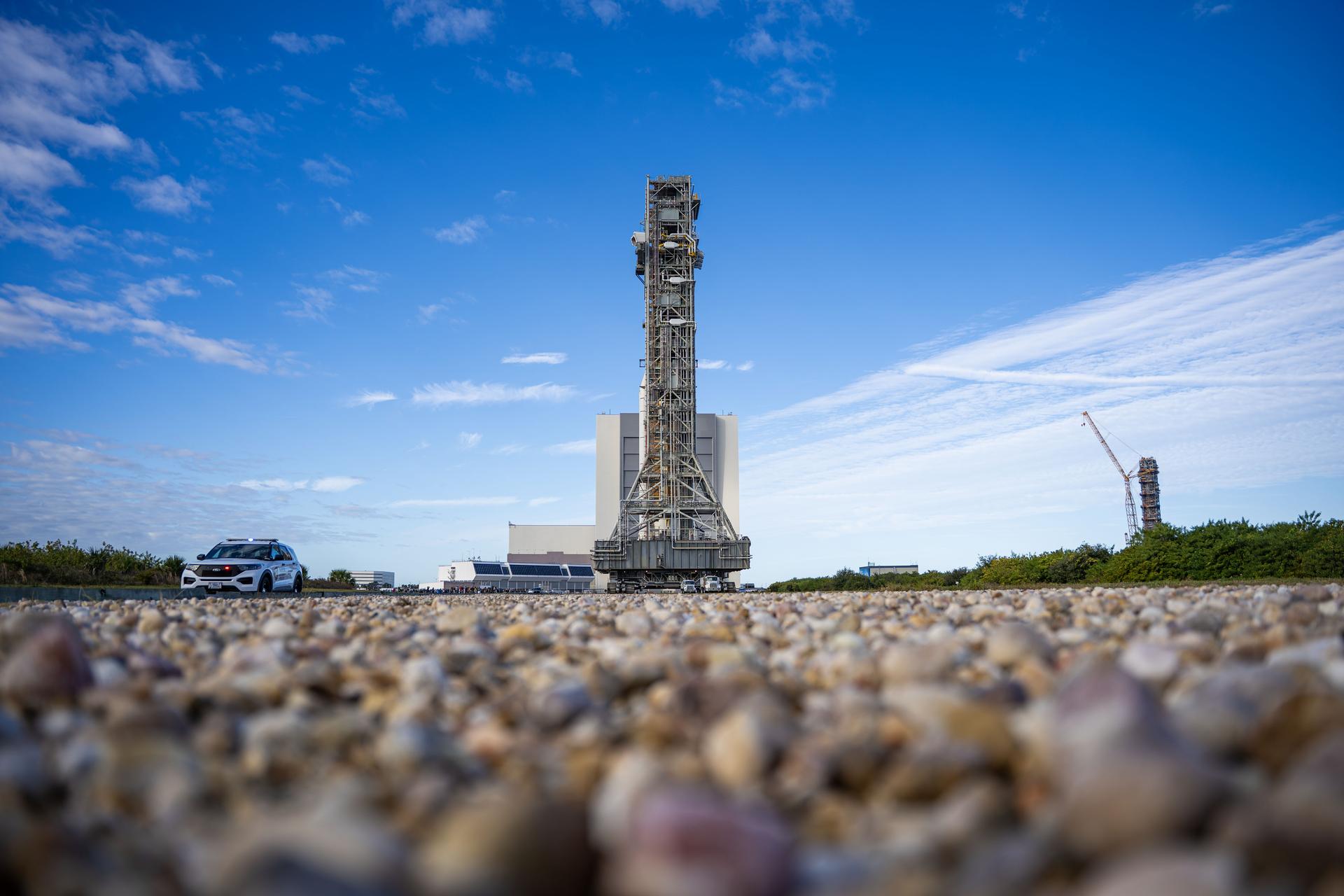 This image shows NASA’s SLS (Space Launch System) and Orion spacecraft rolling out of the Vehicle Assembly Building at NASA’s Kennedy Space Center. NASA's massive Crawler-Transporter, upgraded for the Artemis program, carries the powerful SLS rocket and Orion spacecraft on the Mobile Launcher from the Vehicle Assembly Building to Launch Pad 39B at Kennedy Space Center   in preparation for the Artemis II mission.  